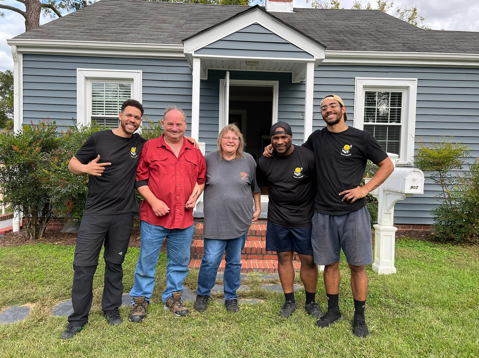 Happy Movers team at a home