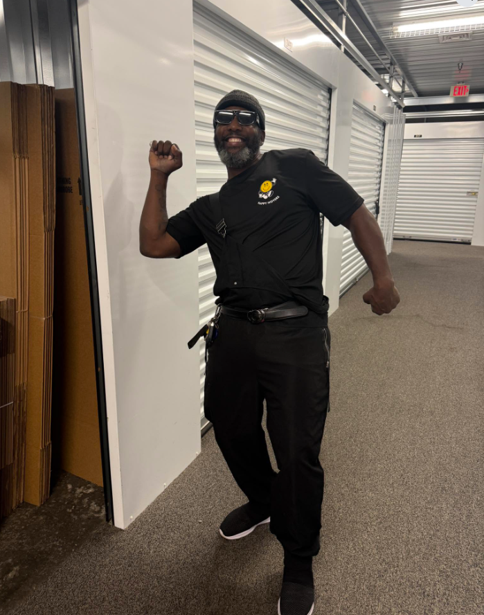 Happy Movers team member at a storage facility