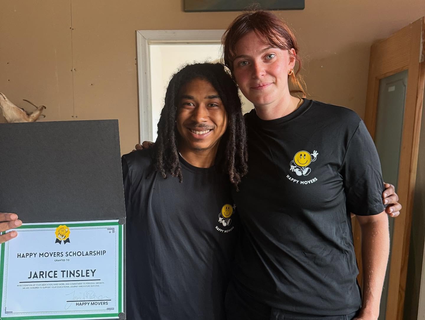 Happy Movers scholarship recipient Jarice Tinsley with team member