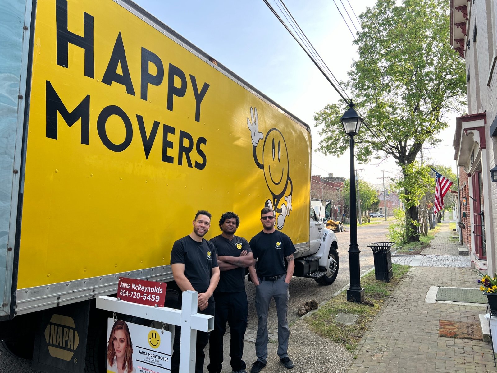 Happy Movers crew in front of the truck